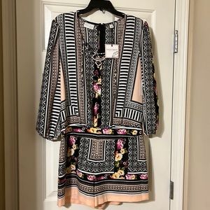 Multi color romper size Large, brand new with tags.